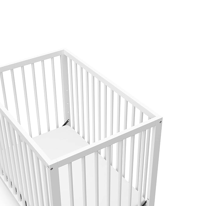 Graco Teddi 4-in-1 Convertible Mini Crib with Bonus Water-Resistant Mattress (White) – GREENGUARD Gold Certified, 2.75-Inch Mattress Included, Convenient Size, Easy 30-Minute Assembly