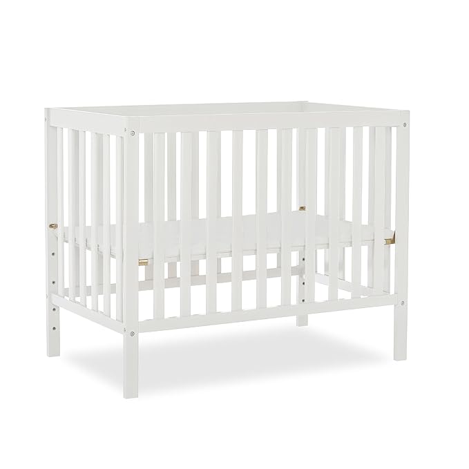 Edgewood 4-In-1 Convertible Mini Crib In White, JPMA Certified, Non-Toxic Finish, New Zealand Pinewood, With 3 Mattress Height Settings, Included 1" Mattress Pad