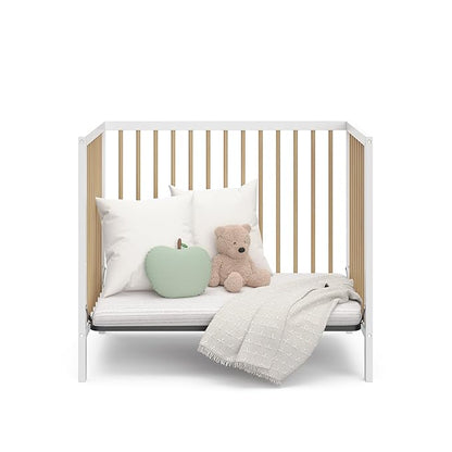 Graco Teddi 4-in-1 Convertible Mini Crib with Bonus Water-Resistant Mattress (White with Driftwood) – GREENGUARD Gold Certified, 2.75-Inch Mattress Included, Convenient Size, Easy 30-Minute Assembly