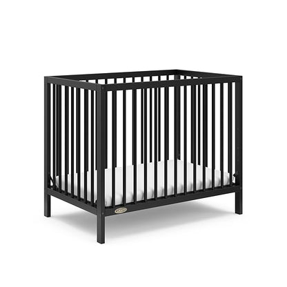 Graco Teddi 4-in-1 Convertible Mini Crib with Bonus Water-Resistant Mattress (Black) – GREENGUARD Gold Certified, 2.75-Inch Mattress Included, Convenient Size, Easy 30-Minute Assembly