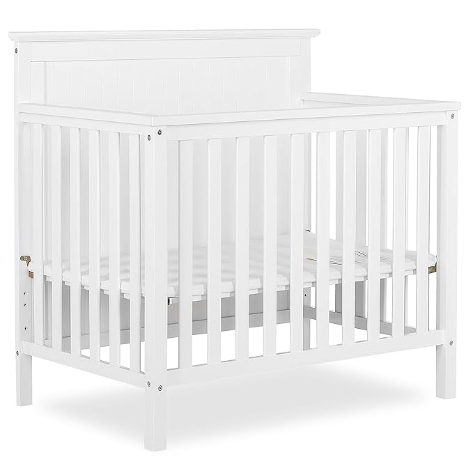 Ava 4-in-1 Convertible Mini Crib in White, Greenguard Gold Certified, Non-Toxic Finish, Comes with 1" Mattress Pad, with 3 Mattress Height Settings