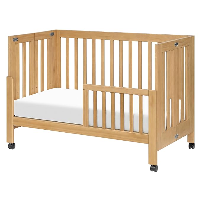 Babyletto Maki Full-Size 2-in-1 Portable Folding Crib with Toddler Bed Conversion Kit in Honey, Greenguard Gold Certified