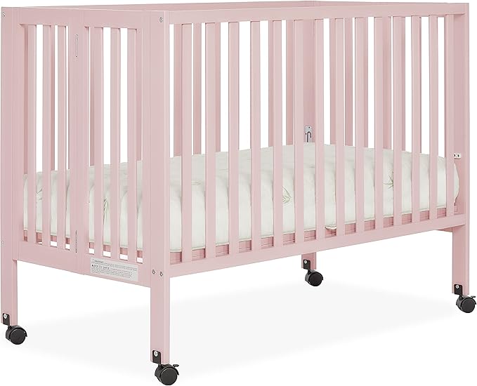 Quinn Full-Size Folding Crib in Blush Pink, Removeable Wheels, Modern Nursey, Adjustable Mattress Support, Portable Crib, Patented Folding System