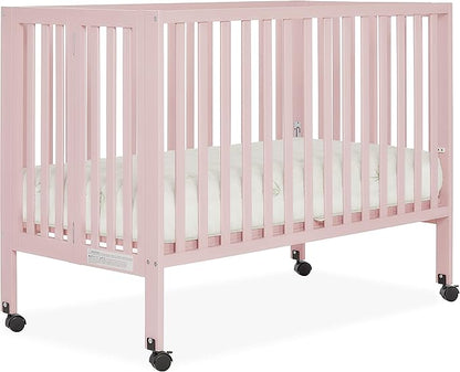 Quinn Full-Size Folding Crib in Blush Pink, Removeable Wheels, Modern Nursey, Adjustable Mattress Support, Portable Crib, Patented Folding System