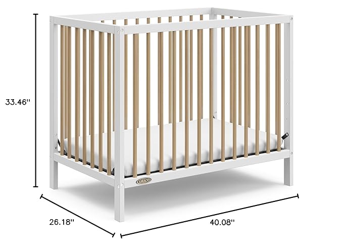 Graco Teddi 4-in-1 Convertible Mini Crib with Bonus Water-Resistant Mattress (White with Driftwood) – GREENGUARD Gold Certified, 2.75-Inch Mattress Included, Convenient Size, Easy 30-Minute Assembly