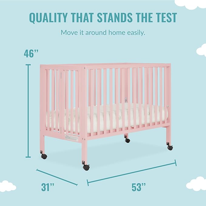 Quinn Full-Size Folding Crib in Blush Pink, Removeable Wheels, Modern Nursey, Adjustable Mattress Support, Portable Crib, Patented Folding System