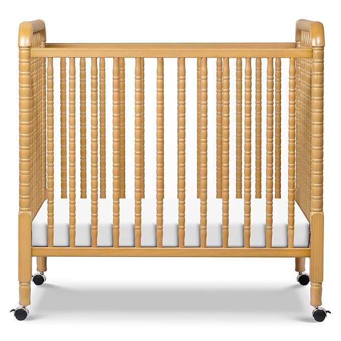 DaVinci Jenny Lind 3-in-1 Convertible Mini Crib in Honey, Removable Wheels, Greenguard Gold Certified