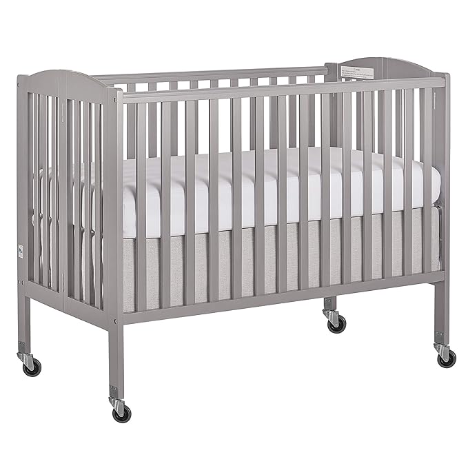 Folding Full Size Convenience Crib In Storm Grey, Two Adjustable Mattress Height Positions, Comes With Heavy Duty Locking Wheels, Flat Folding