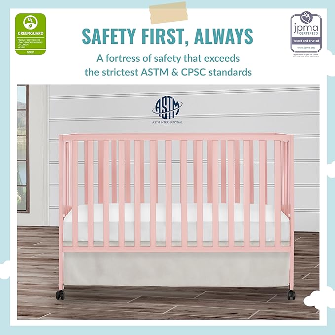 Quinn Full-Size Folding Crib in Blush Pink, Removeable Wheels, Modern Nursey, Adjustable Mattress Support, Portable Crib, Patented Folding System