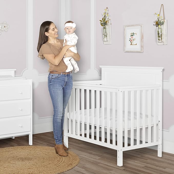 Ava 4-in-1 Convertible Mini Crib in White, Greenguard Gold Certified, Non-Toxic Finish, Comes with 1" Mattress Pad, with 3 Mattress Height Settings
