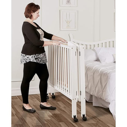 3 in 1 Portable Folding Stationary Side Crib in White, Greenguard Gold Certified, Safety Wheel with Locking Casters, Convertible, 3 Mattress Heights