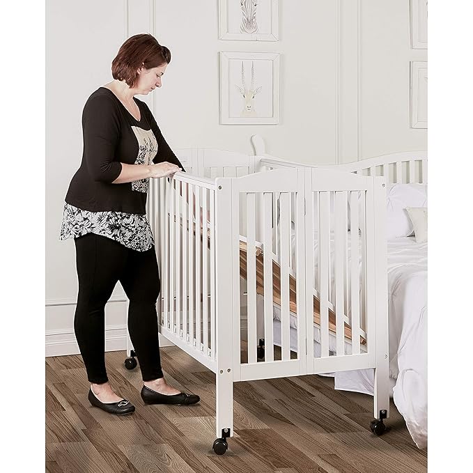 3 in 1 Portable Folding Stationary Side Crib in White, Greenguard Gold Certified, Safety Wheel with Locking Casters, Convertible, 3 Mattress Heights