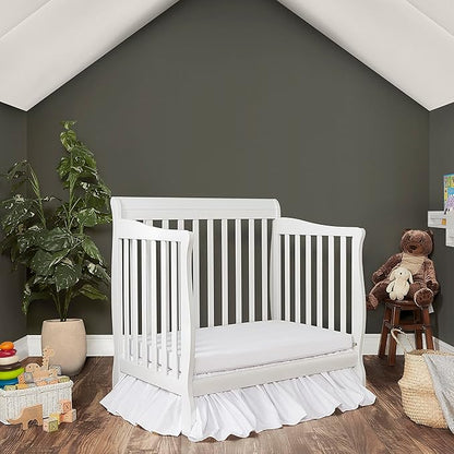Aden 4-in-1 Convertible Mini Crib In White, Greenguard Gold Certified, Non-Toxic Finish, New Zealand Pinewood, With 3 Mattress Height Settings